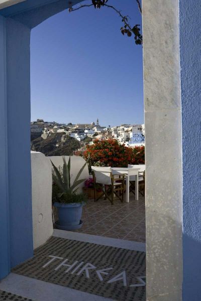 Greece, Santorini Doorway to balcony tables